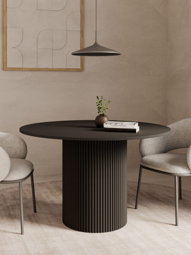 Czarny okrągły stół do jadalni z ryflowaną nogą, elegancki akcent do nowoczesnych wnętrz