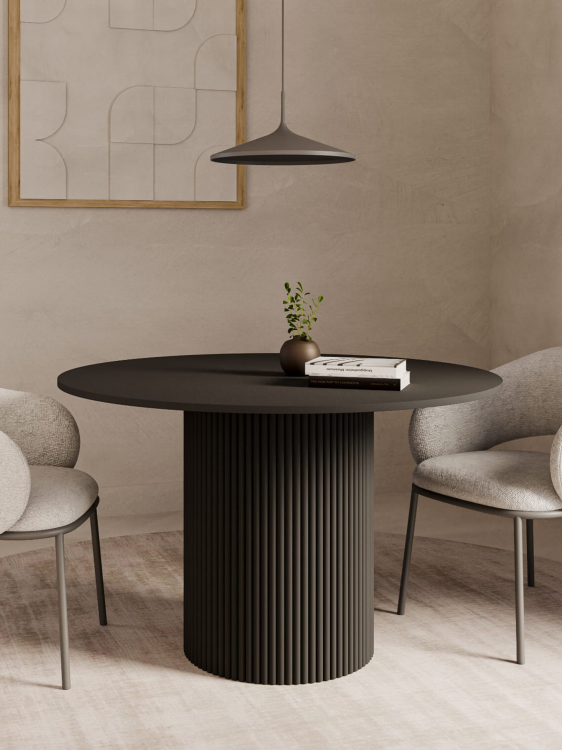 Czarny okrągły stół do jadalni z ryflowaną nogą, elegancki akcent do nowoczesnych wnętrz