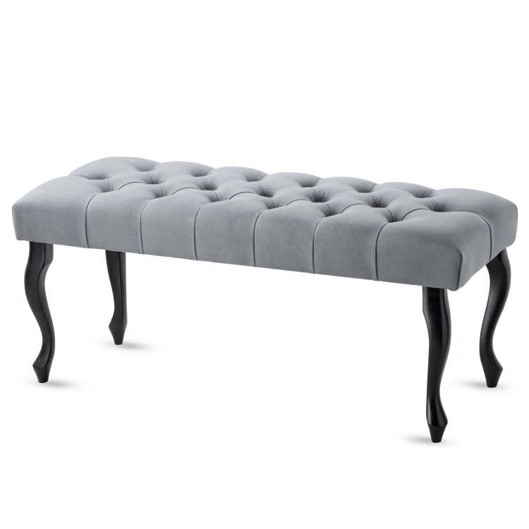 Pikowana ławka w kolorze szarym z czarnymi nogami